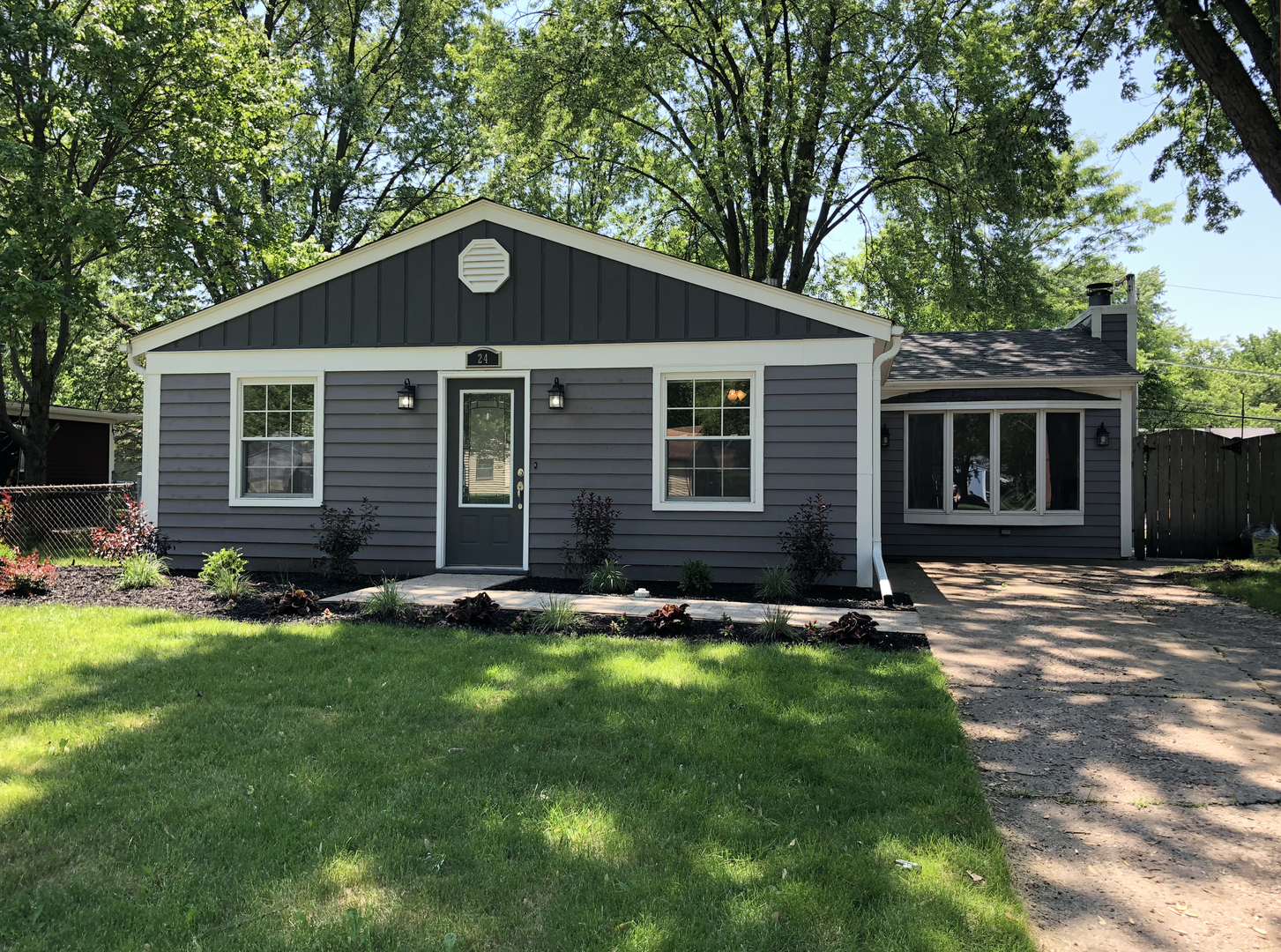 24 Pomeroy Road Montgomery, IL 60538 - Photo 1 of 29 a front view of a house with a yard and garage