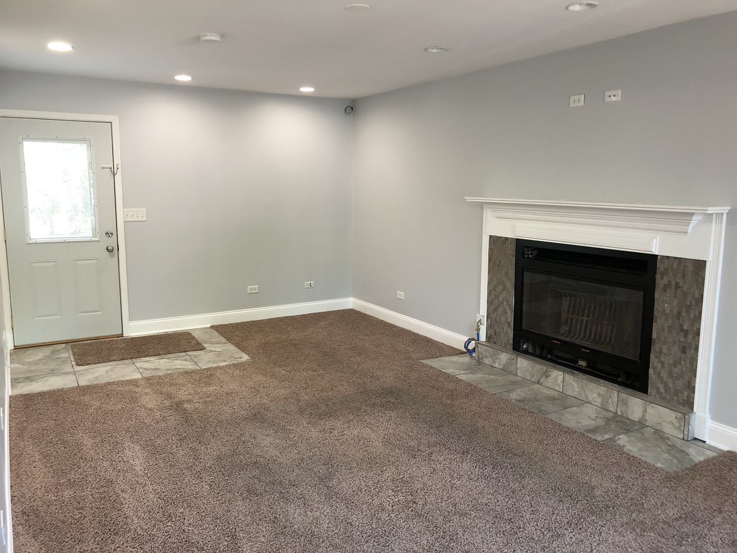 24 Pomeroy Road Montgomery, IL 60538 - Photo 12 of 29 an empty room with a fireplace