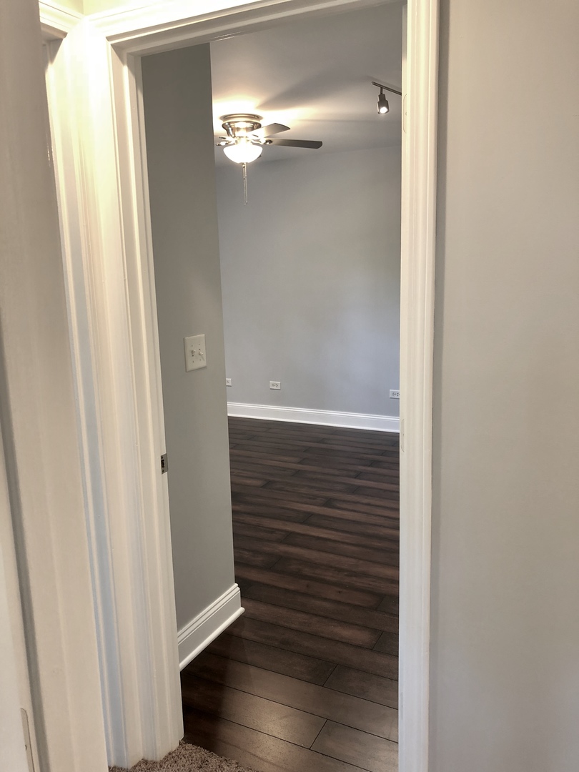 24 Pomeroy Road Montgomery, IL 60538 - Photo 19 of 29 a view of a hallway with wooden floor