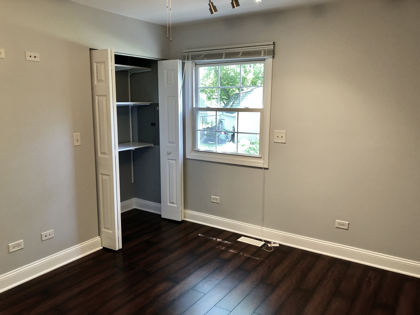24 Pomeroy Road Montgomery, IL 60538 - Photo 20 of 29 an empty room with wooden floor and windows