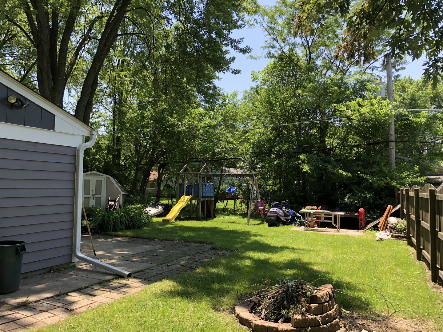 24 Pomeroy Road Montgomery, IL 60538 - Photo 25 of 29 a view of a backyard with a patio and a slide