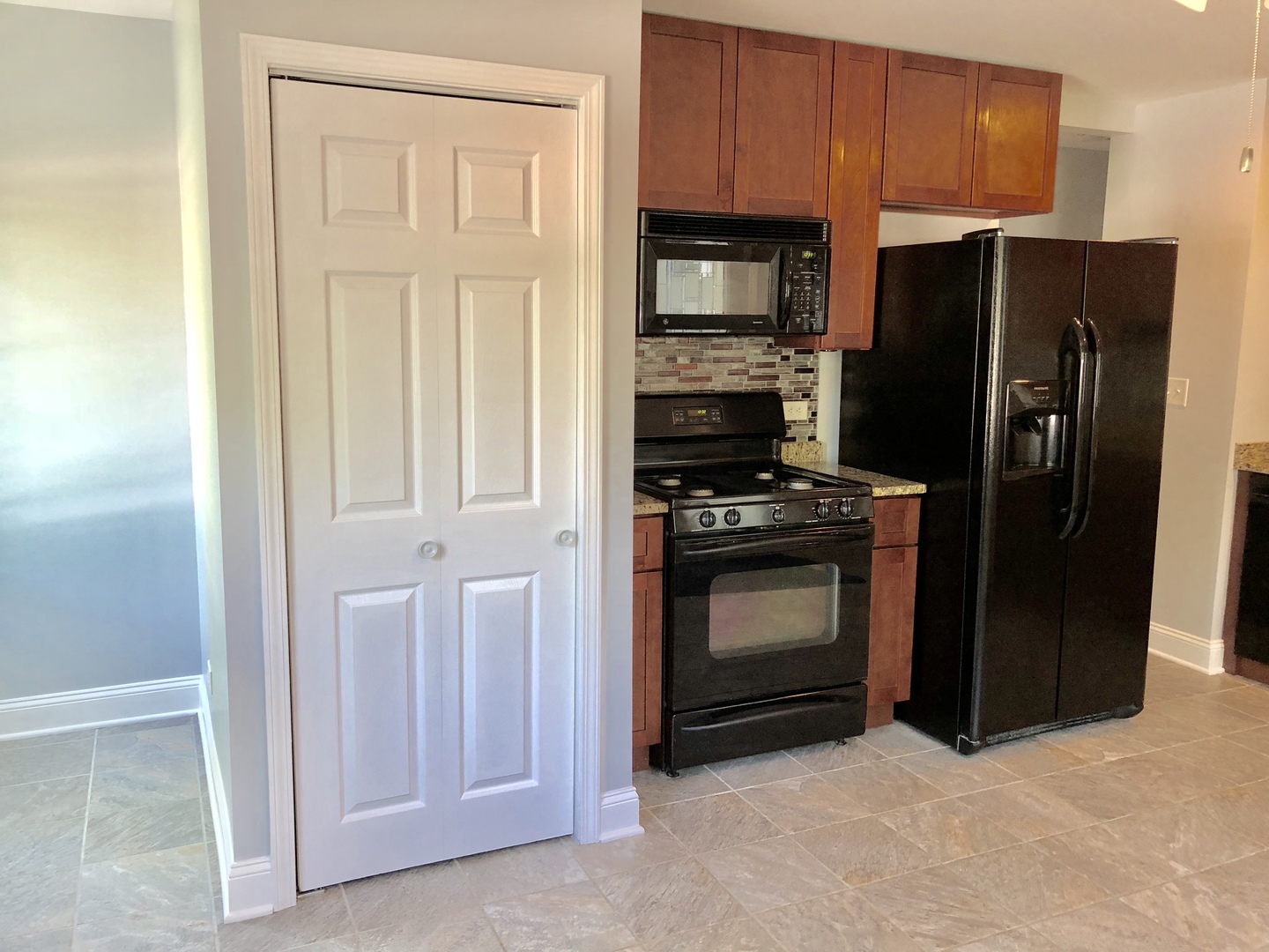 24 Pomeroy Road Montgomery, IL 60538 - Photo 7 of 29 a kitchen with stainless steel appliances granite countertop a refrigerator stove and a sink