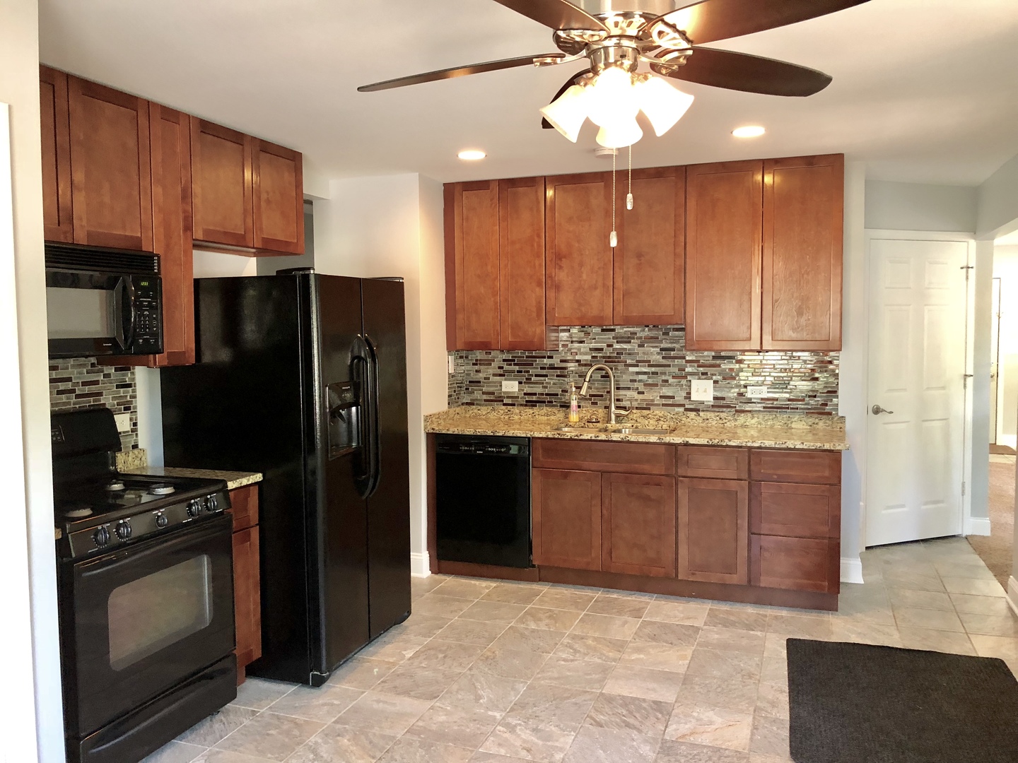 24 Pomeroy Road Montgomery, IL 60538 - Photo 8 of 29 a kitchen with stainless steel appliances granite countertop wooden cabinets a refrigerator and a sink
