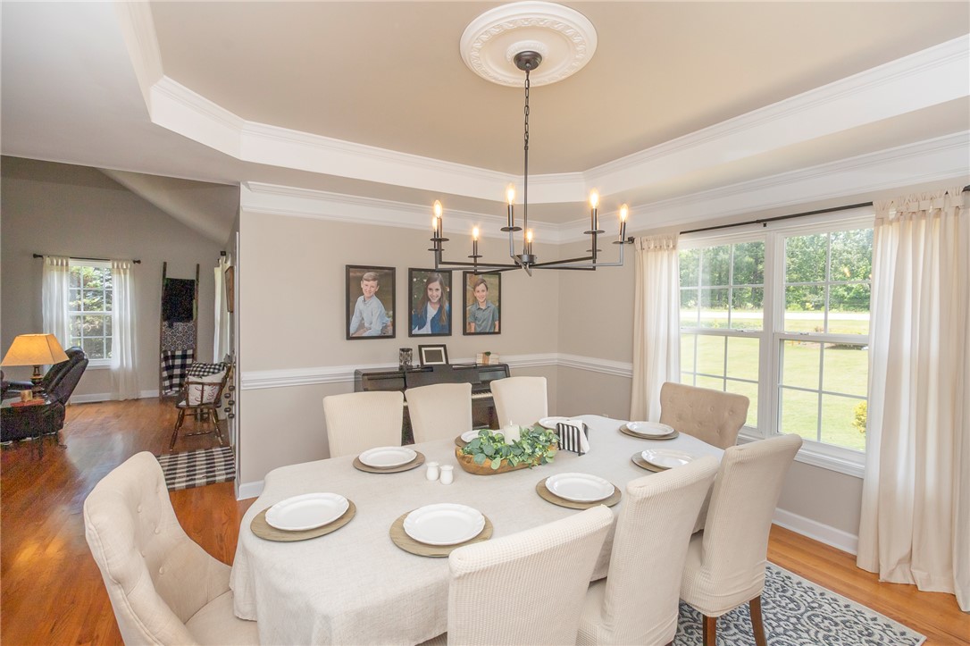 861 North Old Pendleton Road Liberty, SC 29657 - Photo 16 of 45 A well-appointed dining area boasts classic crown molding and a contemporary chandelier.