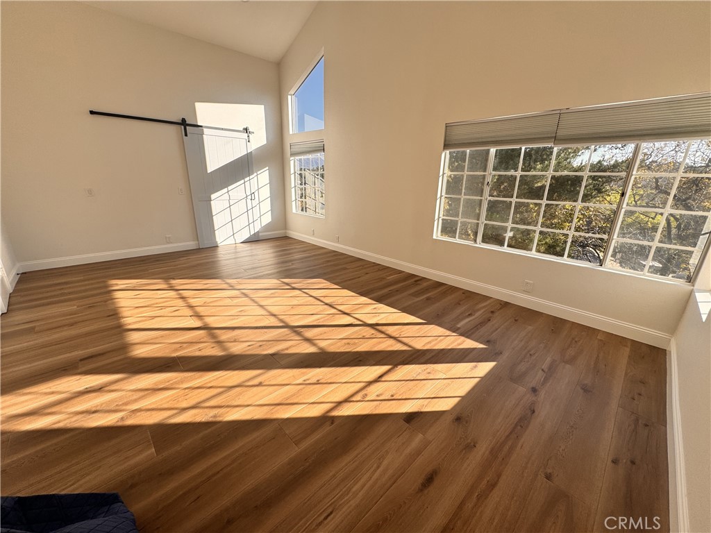 2008 Calle Francesca San Dimas, CA 91773 - Photo 13 of 25 a view of a room with wooden floor and windows