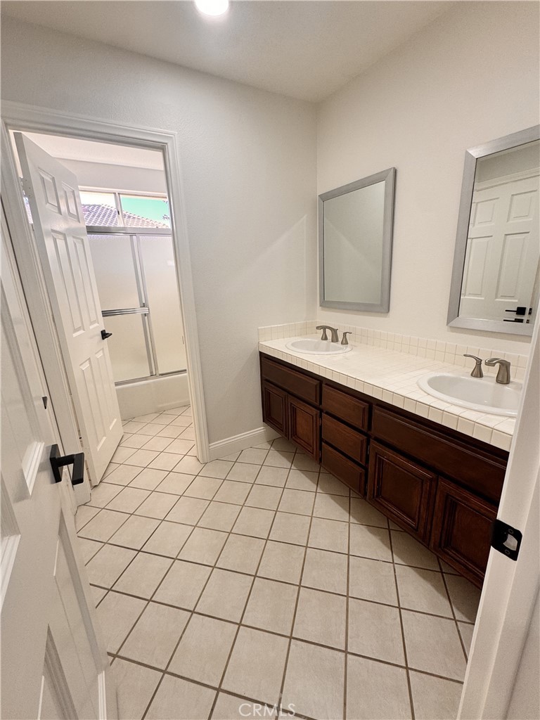 2008 Calle Francesca San Dimas, CA 91773 - Photo 18 of 25 a bathroom with a sink a mirror and a shower