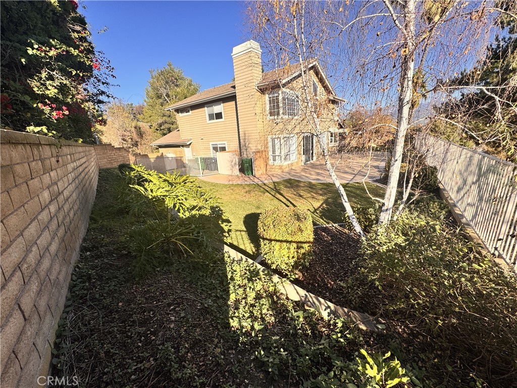 2008 Calle Francesca San Dimas, CA 91773 - Photo 21 of 25 a view of a yard with plants and wooden fence