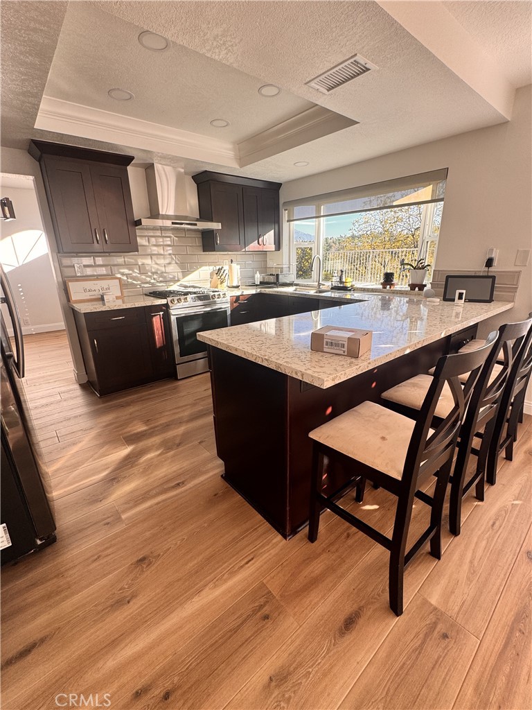 2008 Calle Francesca San Dimas, CA 91773 - Photo 5 of 25 a kitchen with stainless steel appliances granite countertop a table chairs sink and cabinets