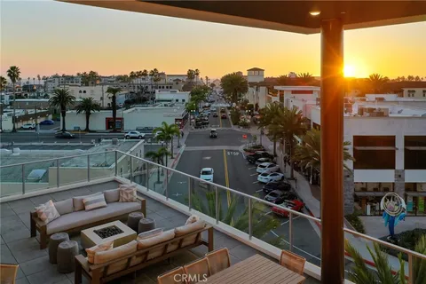 a view of a balcony with two chairs