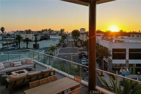 a terrace with outdoor seating and city view