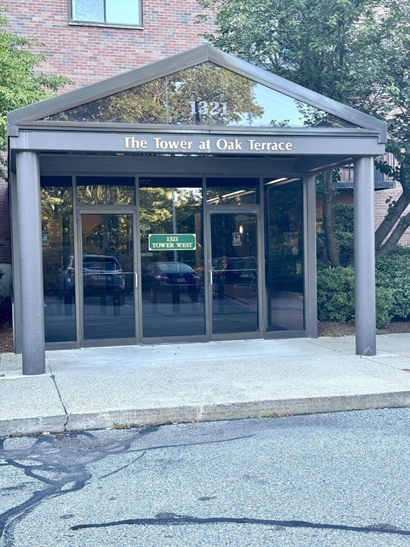 1321 Worcester Road, Unit 603 Framingham, MA 01701 - Photo 20 of 21 a front view of a building with glass door