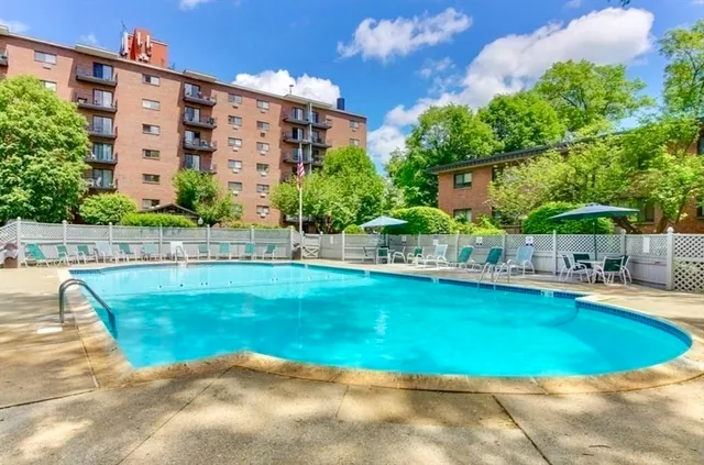 a view of a swimming pool with a patio