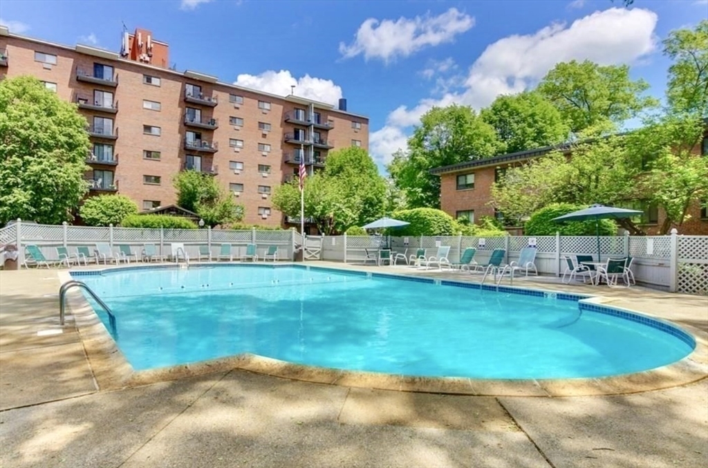 1321 Worcester Road, Unit 603 Framingham, MA 01701 - Photo 2 of 21 a view of a swimming pool with a patio