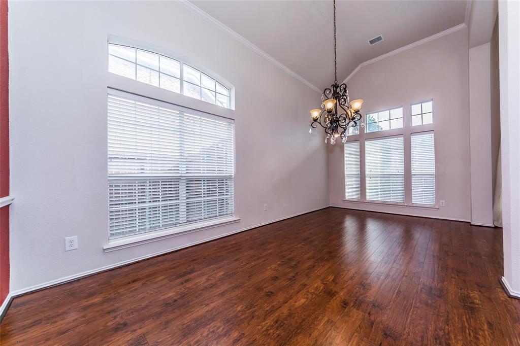 413 Sunrise Drive Allen, TX 75002 - Photo 11 of 23 a view of an empty room with wooden floor and a window