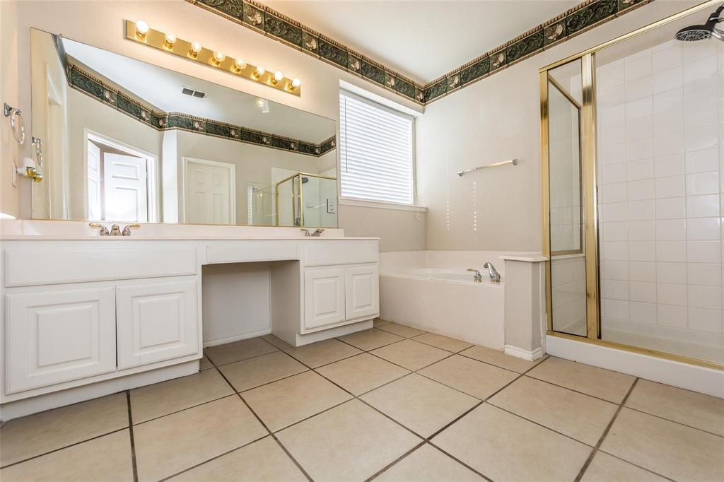 413 Sunrise Drive Allen, TX 75002 - Photo 17 of 23 a bathroom with a sink a toilet and shower