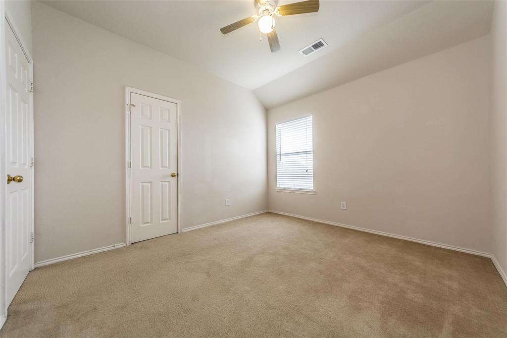 413 Sunrise Drive Allen, TX 75002 - Photo 18 of 23 an empty room with windows and fan