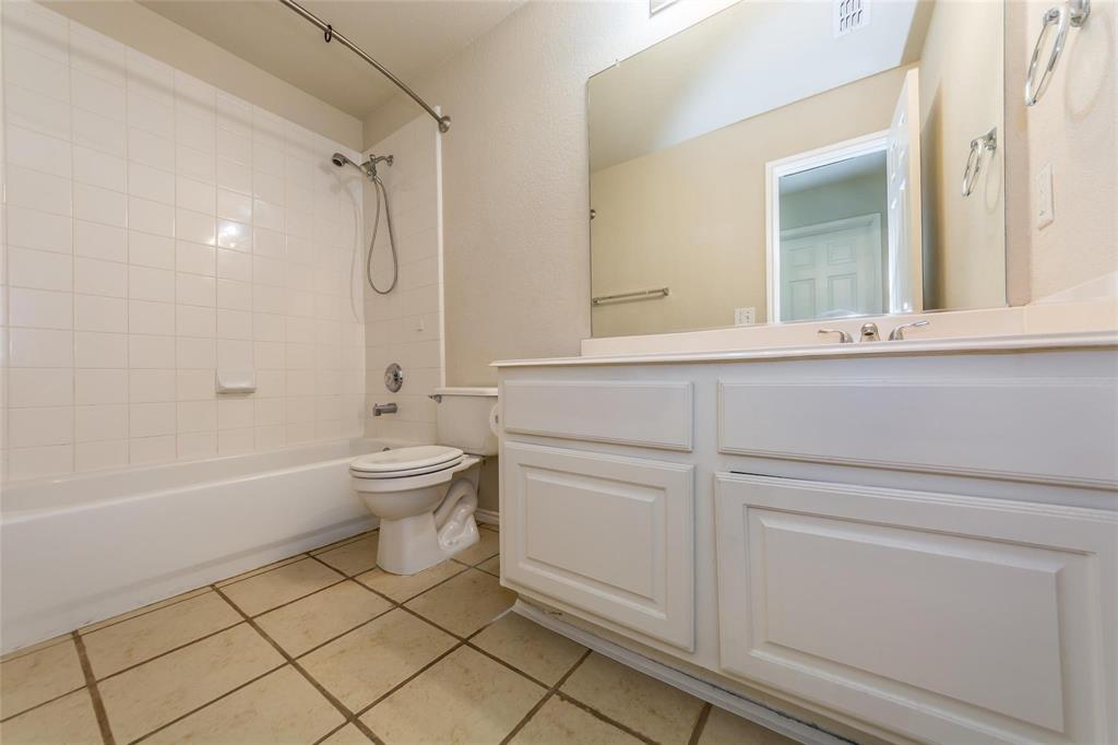 413 Sunrise Drive Allen, TX 75002 - Photo 21 of 23 a bathroom with a sink a toilet and a bathtub