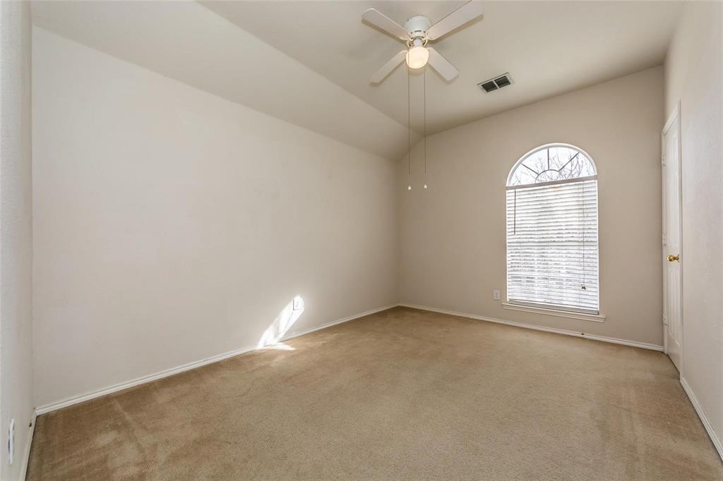413 Sunrise Drive Allen, TX 75002 - Photo 22 of 23 an empty room with a window and a fan