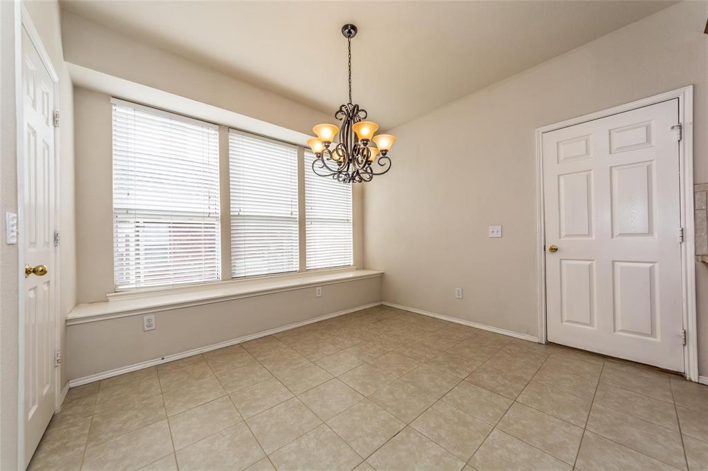 413 Sunrise Drive Allen, TX 75002 - Photo 10 of 23 a view of a room with window and chandelier