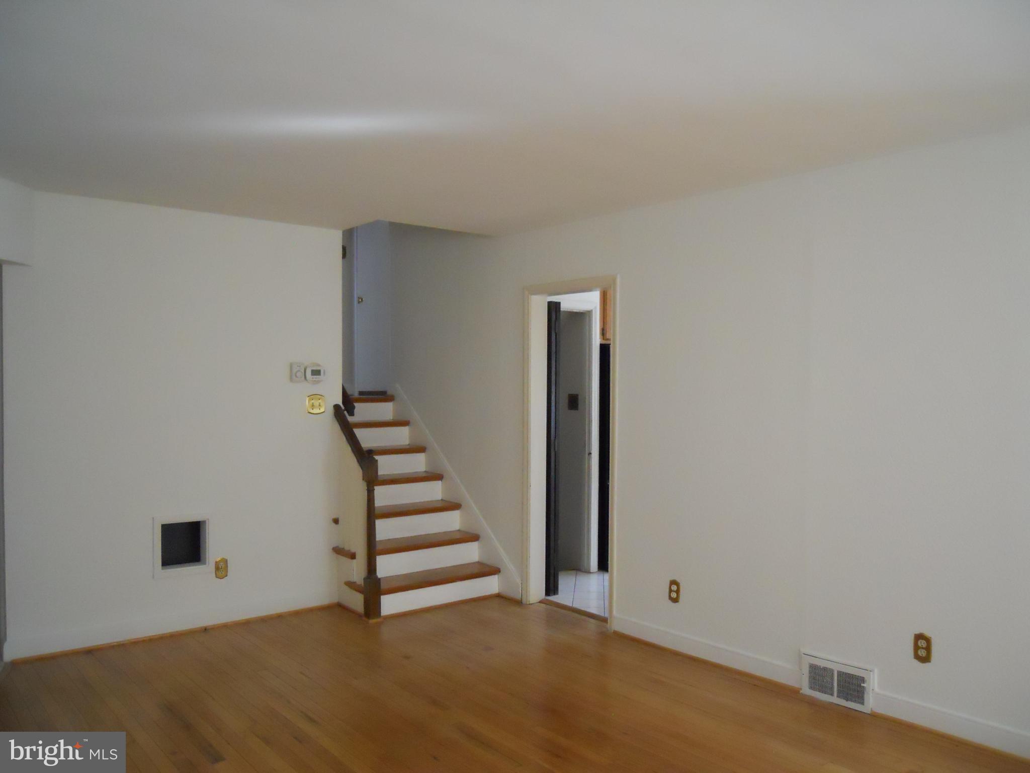 909 Brighton Avenue Reading, PA 19606 - Photo 15 of 35 a view of an empty room with stairs