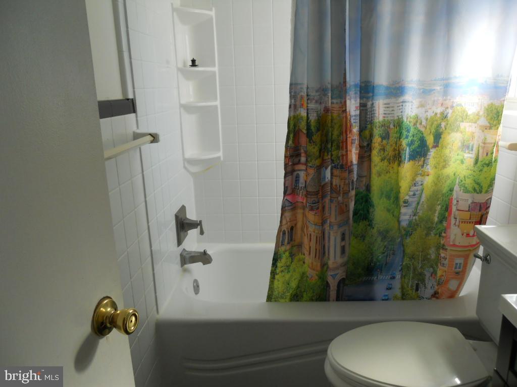 909 Brighton Avenue Reading, PA 19606 - Photo 21 of 35 a bathroom with a toilet and a shower