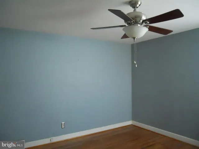 a view of storage and utility room with a refrigerator