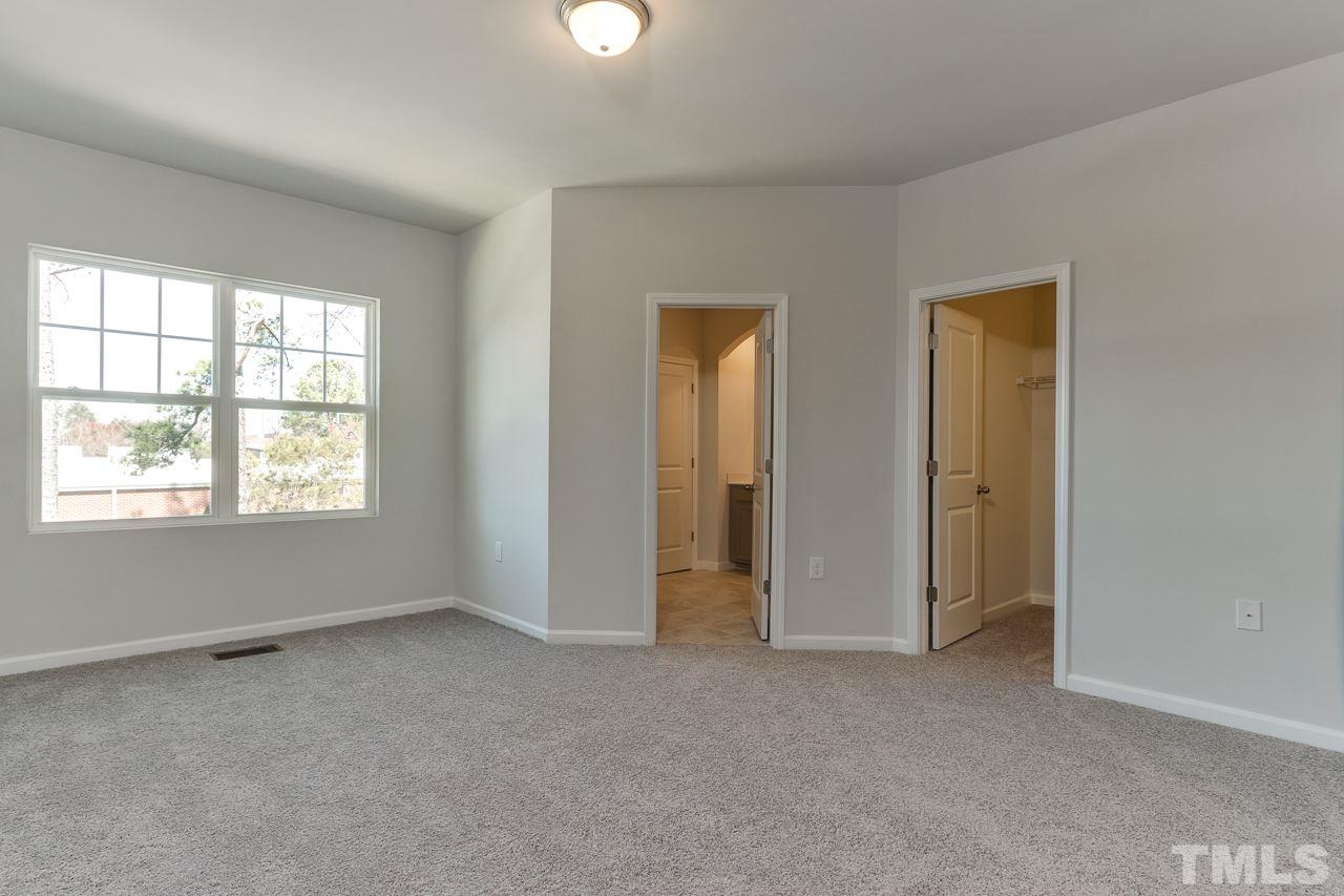 6055 Beale Loop, Unit 25 ABBEY Raleigh, NC 27616 - Photo 13 of 27 a view of an empty room and window