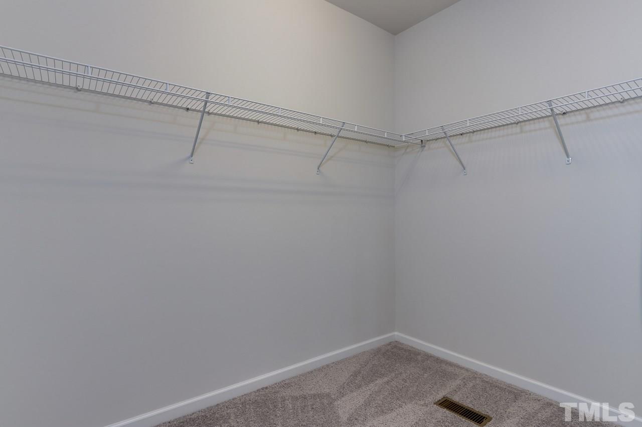 6055 Beale Loop, Unit 25 ABBEY Raleigh, NC 27616 - Photo 17 of 27 a view of a room with racks on the wall