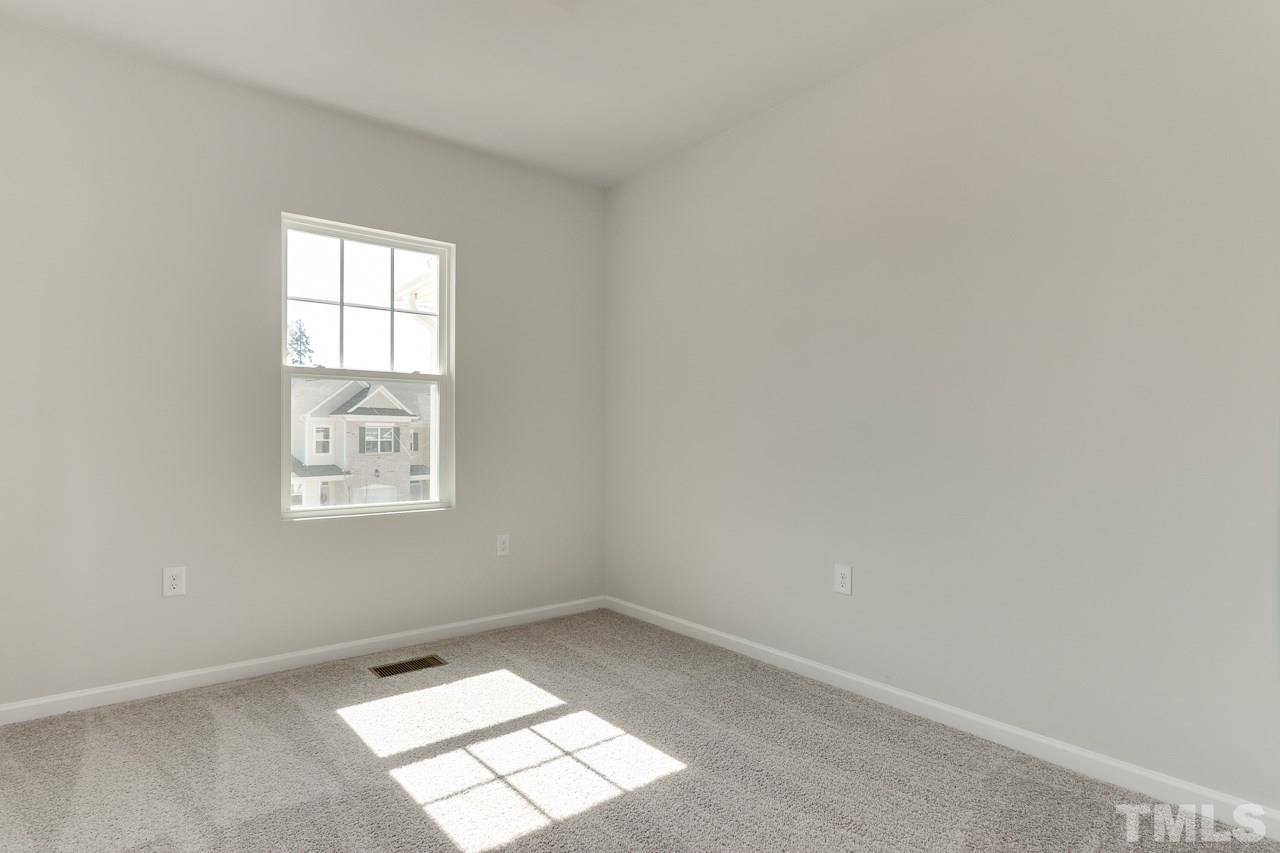 6055 Beale Loop, Unit 25 ABBEY Raleigh, NC 27616 - Photo 20 of 27 an empty room with a window