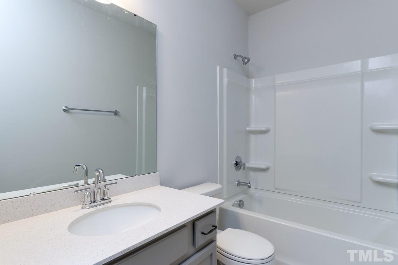 6055 Beale Loop, Unit 25 ABBEY Raleigh, NC 27616 - Photo 22 of 27 a bathroom with a sink toilet bathtub and shower