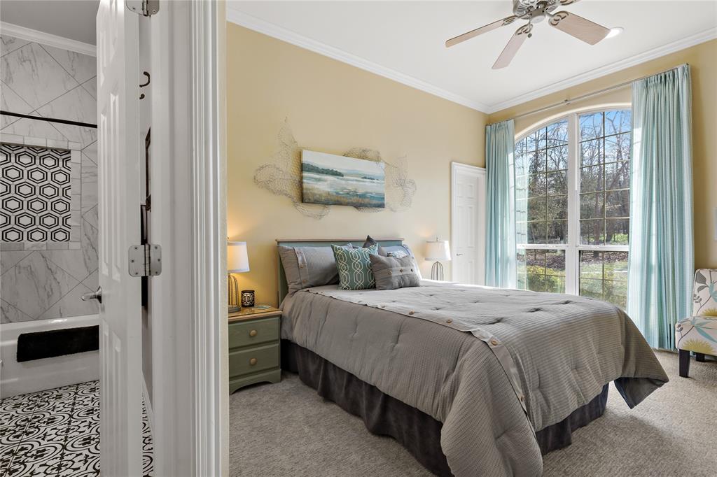 571 Hidden Lake Drive Powderly, TX 75473 - Photo 11 of 40 a bedroom with a bed and a window