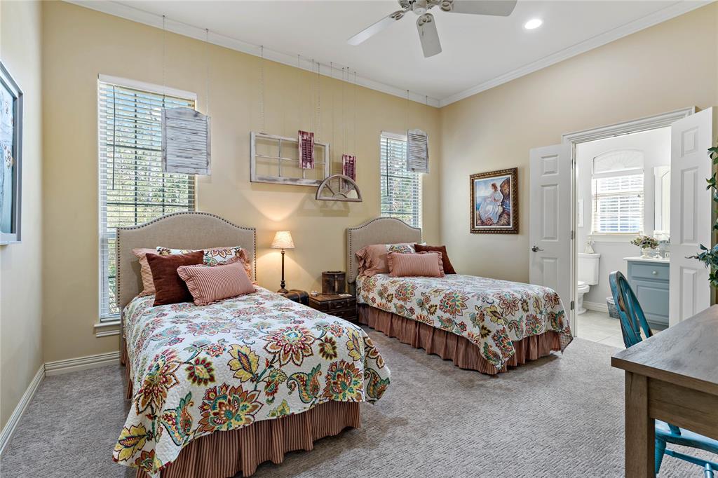 571 Hidden Lake Drive Powderly, TX 75473 - Photo 13 of 40 a bedroom with two beds and painting on the wall