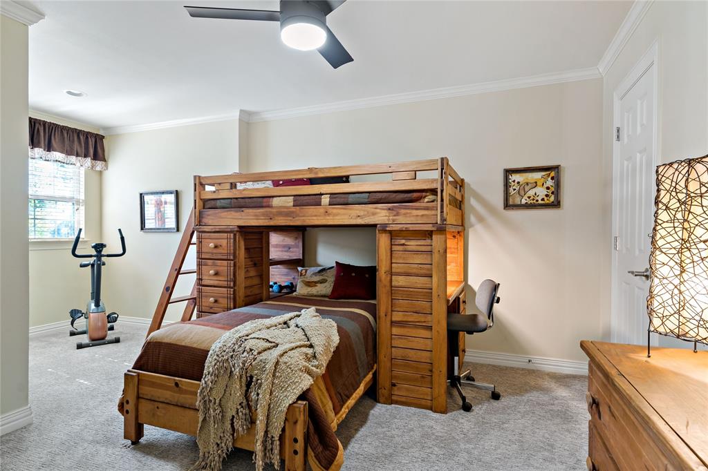 571 Hidden Lake Drive Powderly, TX 75473 - Photo 17 of 40 a bedroom with bed and a window