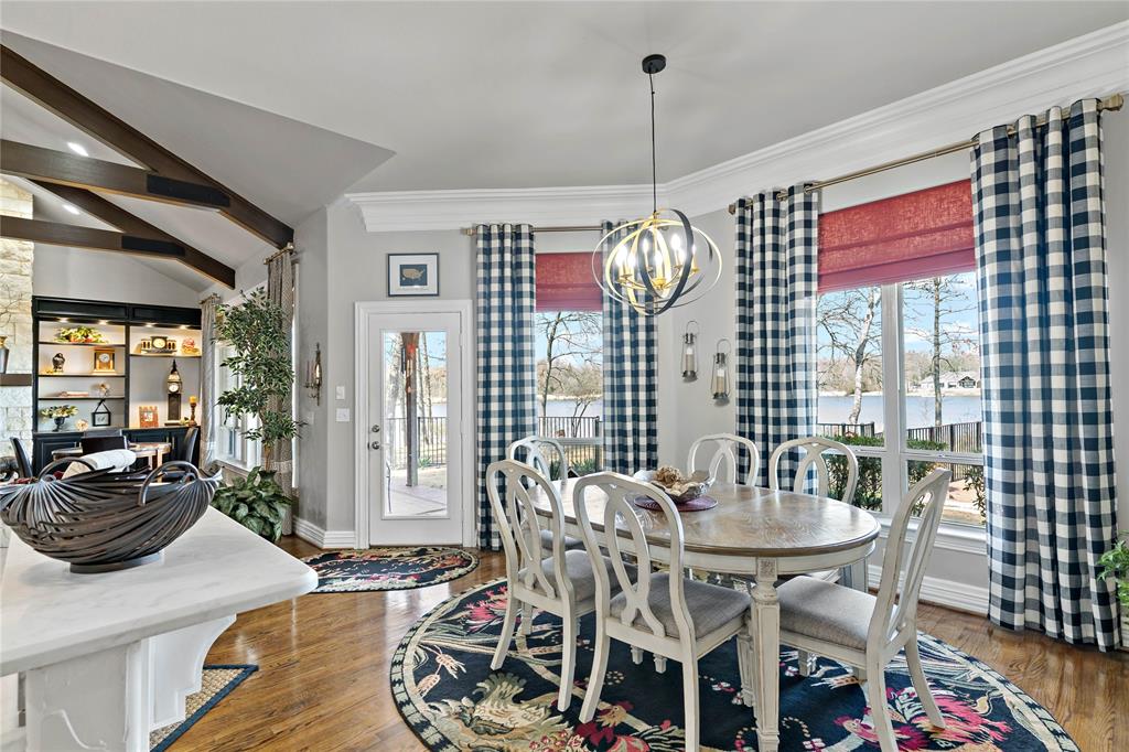 571 Hidden Lake Drive Powderly, TX 75473 - Photo 22 of 40 a view of a dining room with furniture wooden floor and chandelier