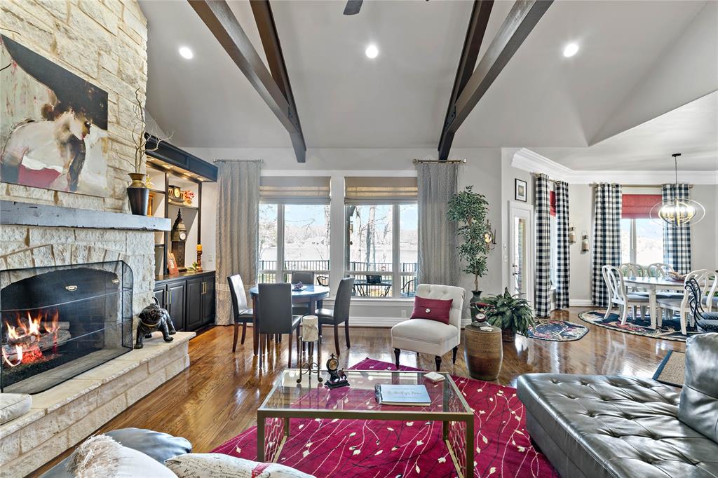 571 Hidden Lake Drive Powderly, TX 75473 - Photo 25 of 40 a living room with furniture fireplace and a large window