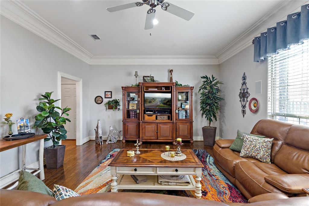571 Hidden Lake Drive Powderly, TX 75473 - Photo 26 of 40 a living room with furniture and flowers