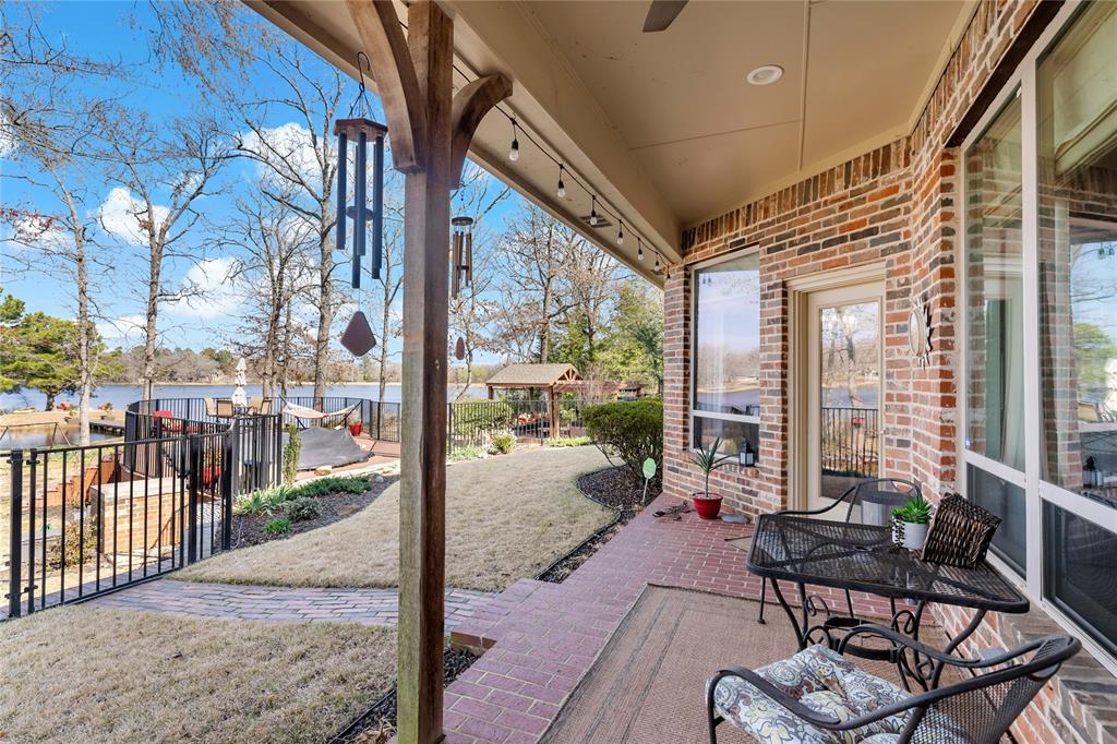 571 Hidden Lake Drive Powderly, TX 75473 - Photo 28 of 40 a building outdoor space with patio furniture and glass door