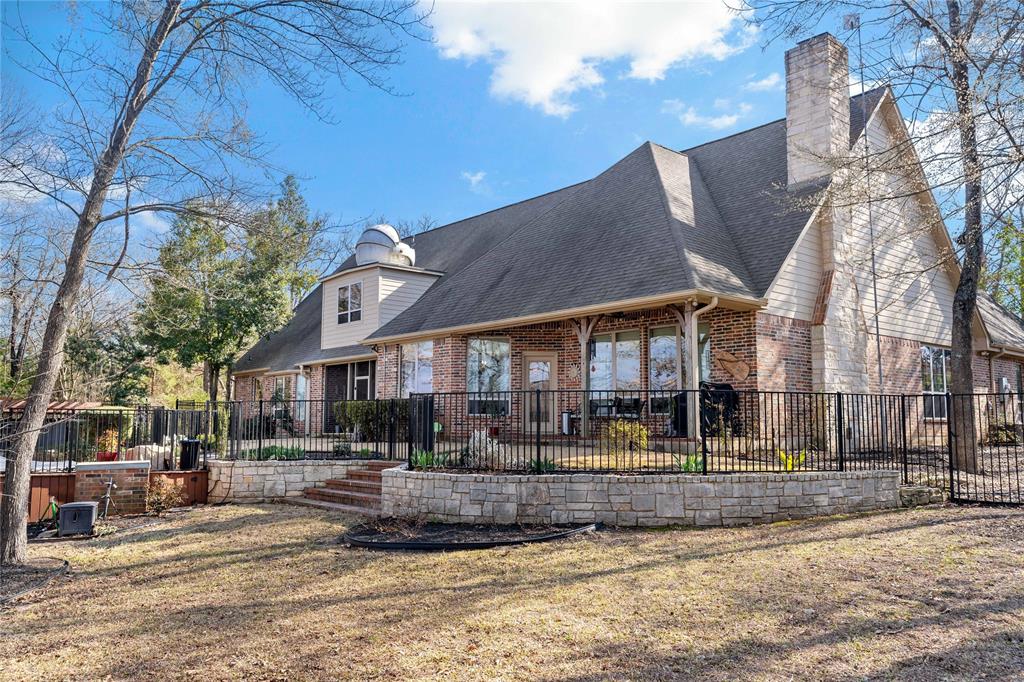 571 Hidden Lake Drive Powderly, TX 75473 - Photo 33 of 40 a view of a town with large trees