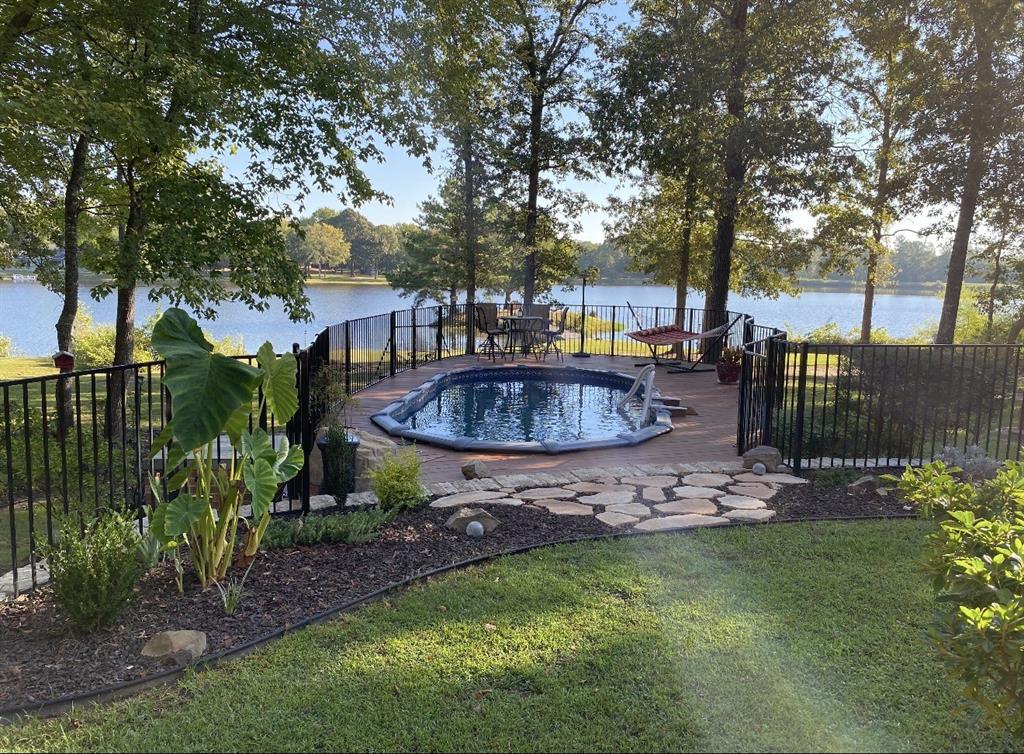 571 Hidden Lake Drive Powderly, TX 75473 - Photo 35 of 40 a view of a backyard with swimming pool
