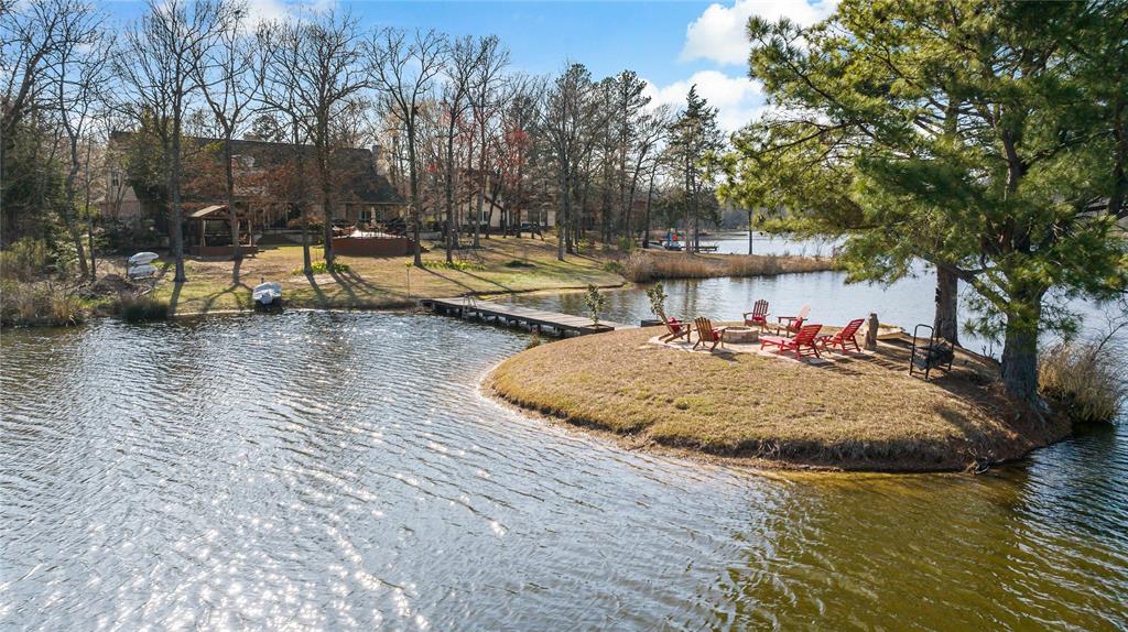 571 Hidden Lake Drive Powderly, TX 75473 - Photo 40 of 40 a view of a swimming pool with an outdoor space and seating area