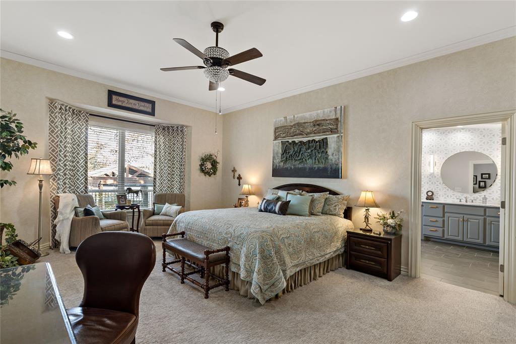 571 Hidden Lake Drive Powderly, TX 75473 - Photo 7 of 40 a bedroom with a bed and a large window