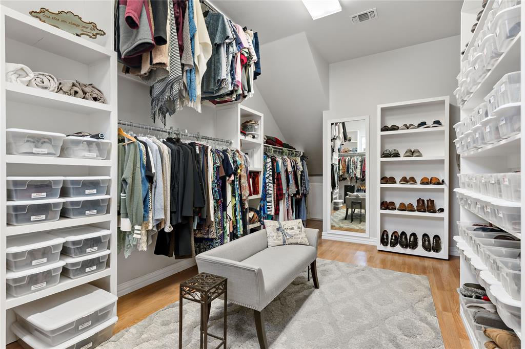 571 Hidden Lake Drive Powderly, TX 75473 - Photo 9 of 40 a view of walk in closet with clothes and shoes