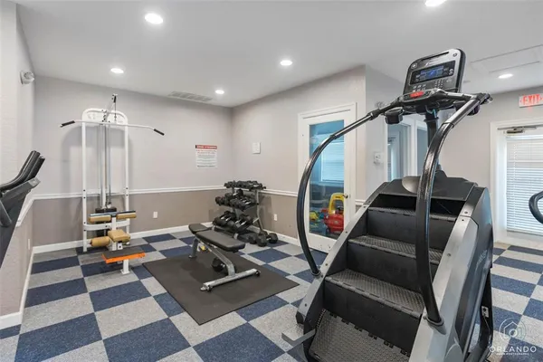 a room with lots of chairs and mirrors