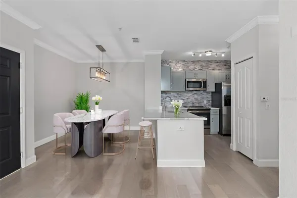 a kitchen with a table and chairs