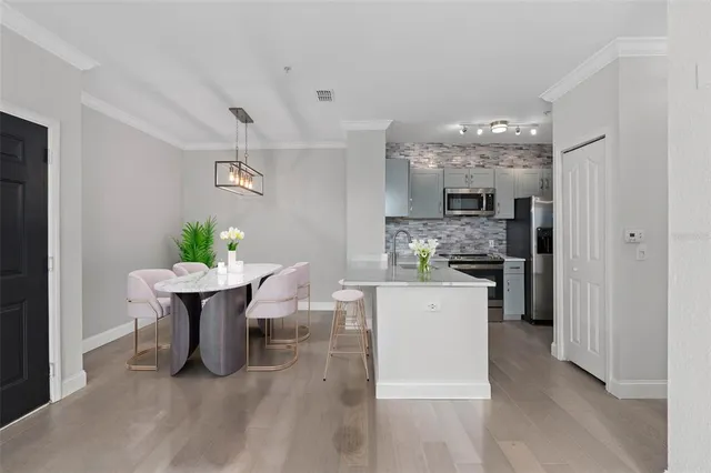 a kitchen with a table and chairs