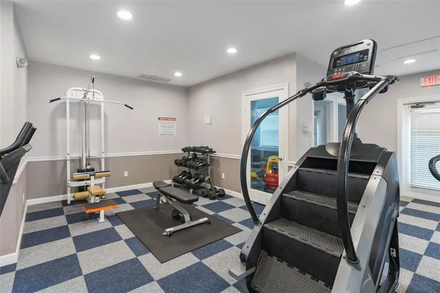 a room with lots of chairs and mirrors