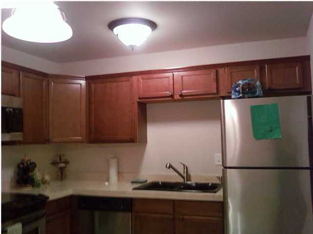 2634 Hwy Santa Rosa Beach, Unit 30A Santa Rosa Beach, FL 32459 - Photo 2 of 12 a kitchen with a refrigerator and cabinets