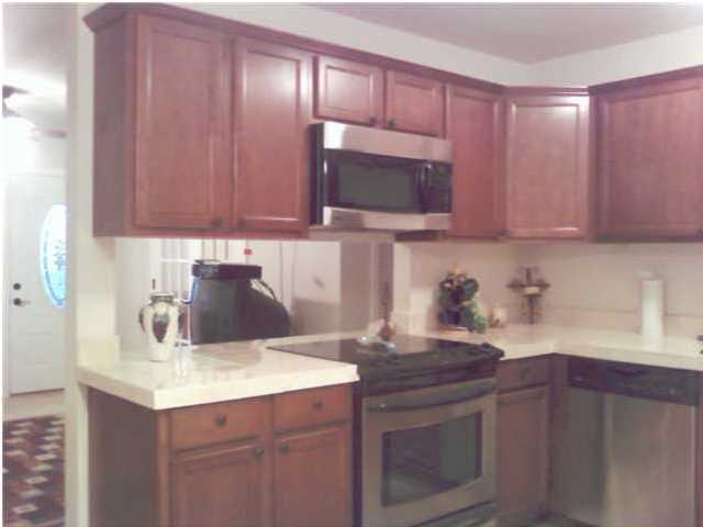 2634 Hwy Santa Rosa Beach, Unit 30A Santa Rosa Beach, FL 32459 - Photo 5 of 12 a kitchen with a sink cabinets and stainless steel appliances