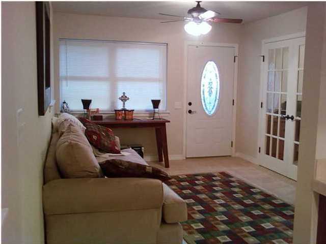 2634 Hwy Santa Rosa Beach, Unit 30A Santa Rosa Beach, FL 32459 - Photo 6 of 12 a living room with furniture a lamp and a window