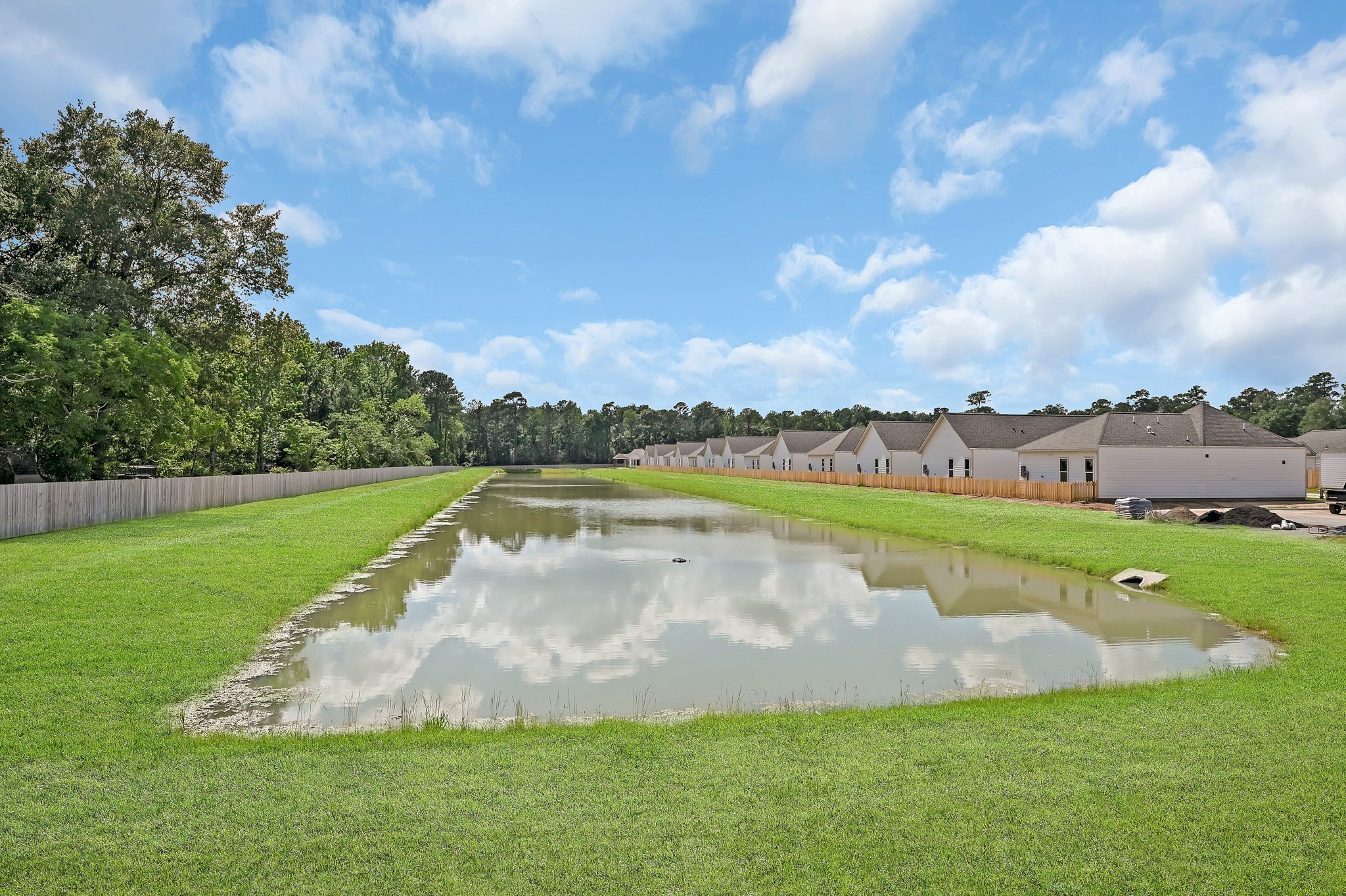 33455 Buckshot Lane, Unit 67 Spring, TX 77382 - Photo 21 of 22 a view of a lake with a big yard